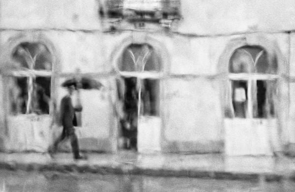 This is one of my all-time favourite photographs. It was taken almost by accident, through the window of my father’s car. The rainy day and the low light turned the image into something close to a painting, where the soft, undefined lines blend perfectly with the figure of the man holding an umbrella. No detail is really needed to understand the scene. It feels complete just as it is.