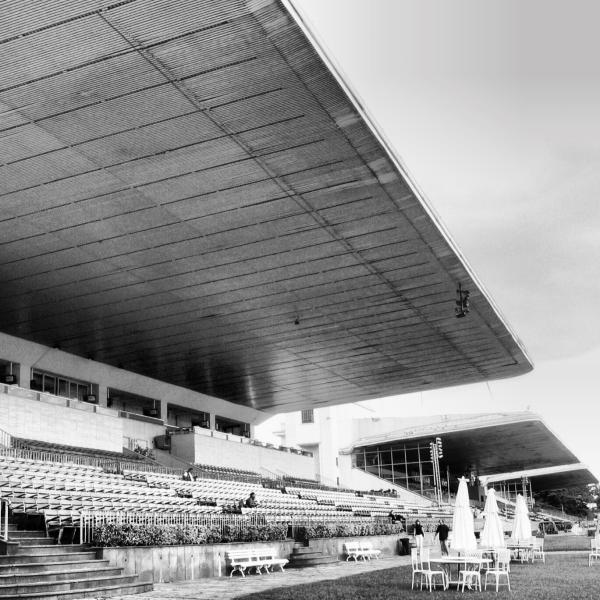Jockey Club de São Paulo. When I was young, my father used to bring me here to watch the horse races. I remember the sound of hooves echoing through the grandstands, the mix of excitement and elegance that filled the air. Standing here years later, I was struck by the architecture. Those sweeping concrete lines, still modern, still full of presence. The place feels quieter now, but the memories remain vivid.